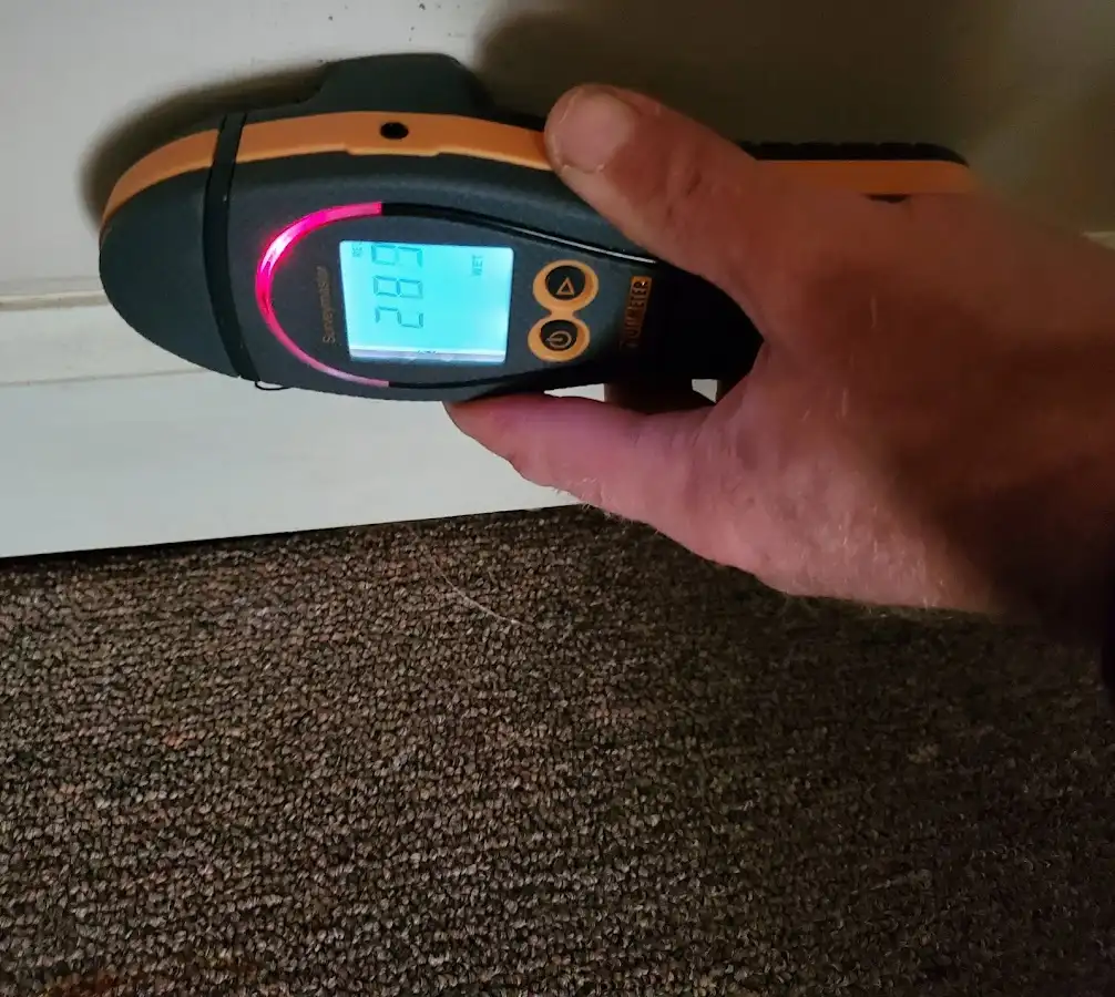 Moisture detection at baseboard during Storm Damage Restoration in Tobyhanna